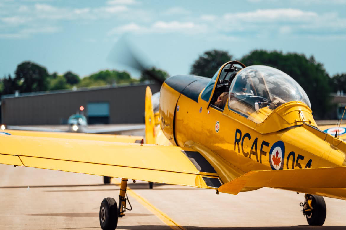 Both Chipmunks taxiing out of taxiway Papa Two, preparing for a left turn to taxi to Runway 27. Image taken by AOPA photographer Jake Teague.